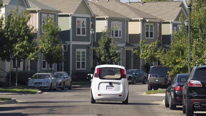 A Google self-driving car tours a housing development Sept. 23 in Austin, Texas.