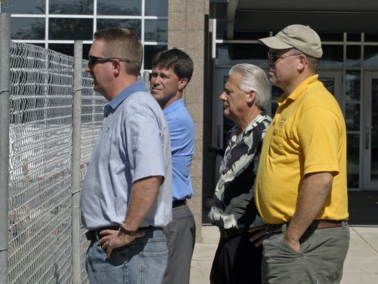 Eric Rose, front left, examines progress on construction at Waukee High School in this file photo from 2006. Rose, now the district's chief operating officer, is at the center of a lawsuit filed by a former district employee. Also pictured, from left, are former Superintendent Dave Wilkerson, former Director of Administrative Services Duane Van Gorp and former school board member Larry Lyon.