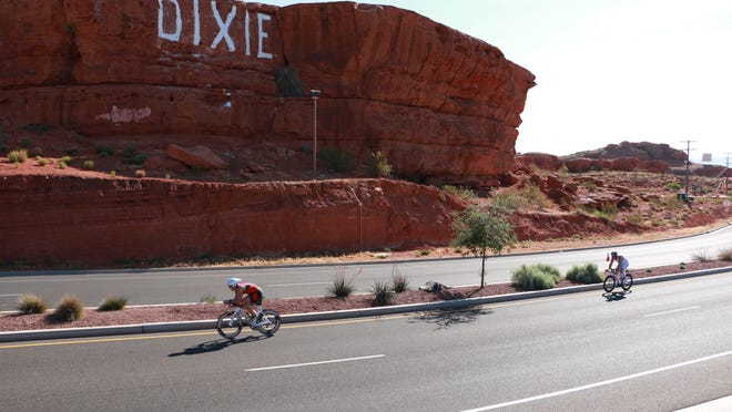 Cyclists speed past the "Sugarloaf" rock in St. George in this Spectrum & Daily News file photo. City officials are soliciting public help developing a comprehensive Active Transportation Plan to improve facilities for cyclists, pedestrians, bus riders and others using alternative forms of transportation.