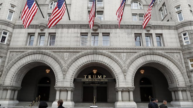 In this photo taken Dec. 21, 2016, the Trump International Hotel in Washington. A Pennsylvania man has been arrested at the Trump International Hotel in Washington after police say they found a rifle and handgun in his car. (AP Photo/Alex Brandon)