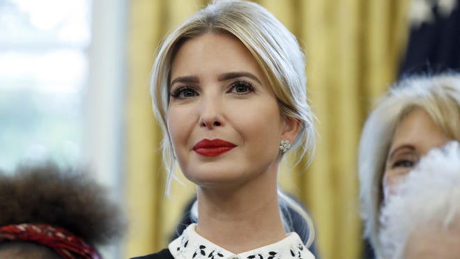 In this Sept. 25, 2017 file photo, Ivanka Trump watches as Donald Trump signs a memorandum to expand access to STEM, science technology engineering and math, education, in the Oval Office of the White House in Washington. The Trump administration on Monday proposed new limits on federal student loans taken out by parents and graduate students as part of a broader plan to curb the cost of college.