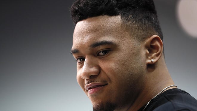 Alabama quarterback Tua Tagovailoa speaks during a press conference at the NFL football scouting combine in Indianapolis.