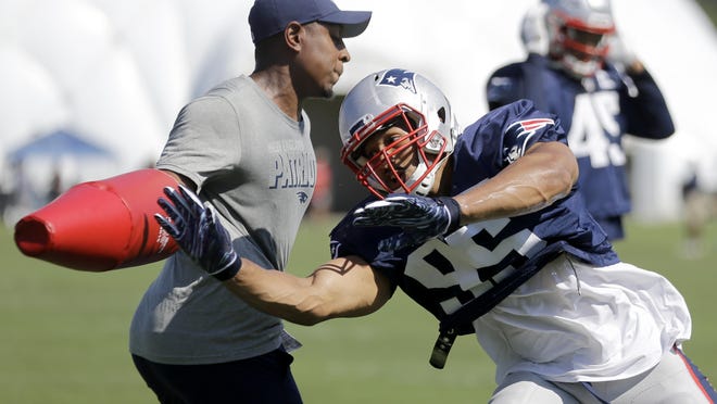 New England Patriots defensive end Derek Rivers runs a drill during a combined training camp with the Tennessee Titans last August.