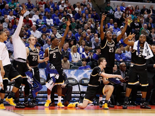 Wichita State Shockers bench players celebrate against