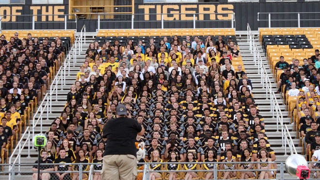 Student-athletes pose for a group picture Friday evening during "Media Day" at Tiger Stadium.