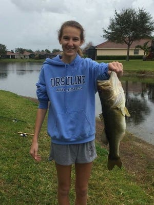 Kelly Flanagan caught and released this bass, her first, during the last week of February while fishing from a pond in Port St. Lucie with her mother and aunt. She used a plastic worm. Tip: Check the rules of the neighborhood before fishing in a backyard pond.
