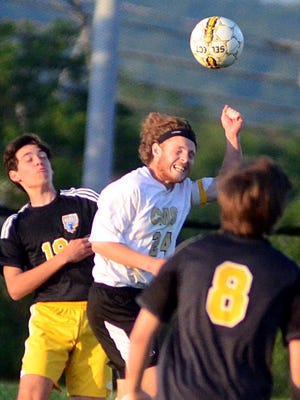 Central Magnet senior Kyle Shoemaker heads the ball in front of Merrol Hyde Magnet sophomore Daniel See during first-half action in Friday evening’s District 8 A-AA championship match. Central Magnet won 4-1.