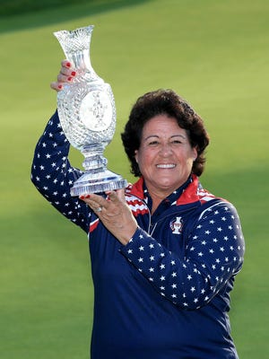Nancy Lopez, one of the vice-captains of the United States Team, proudly holds the Solheim Cup trophy after the closing ceremony during the final day singles matches in the 2015 Solheim Cup at St Leon-Rot Golf Club on September 20, 2015 in Sankt Leon-Rot, Germany.