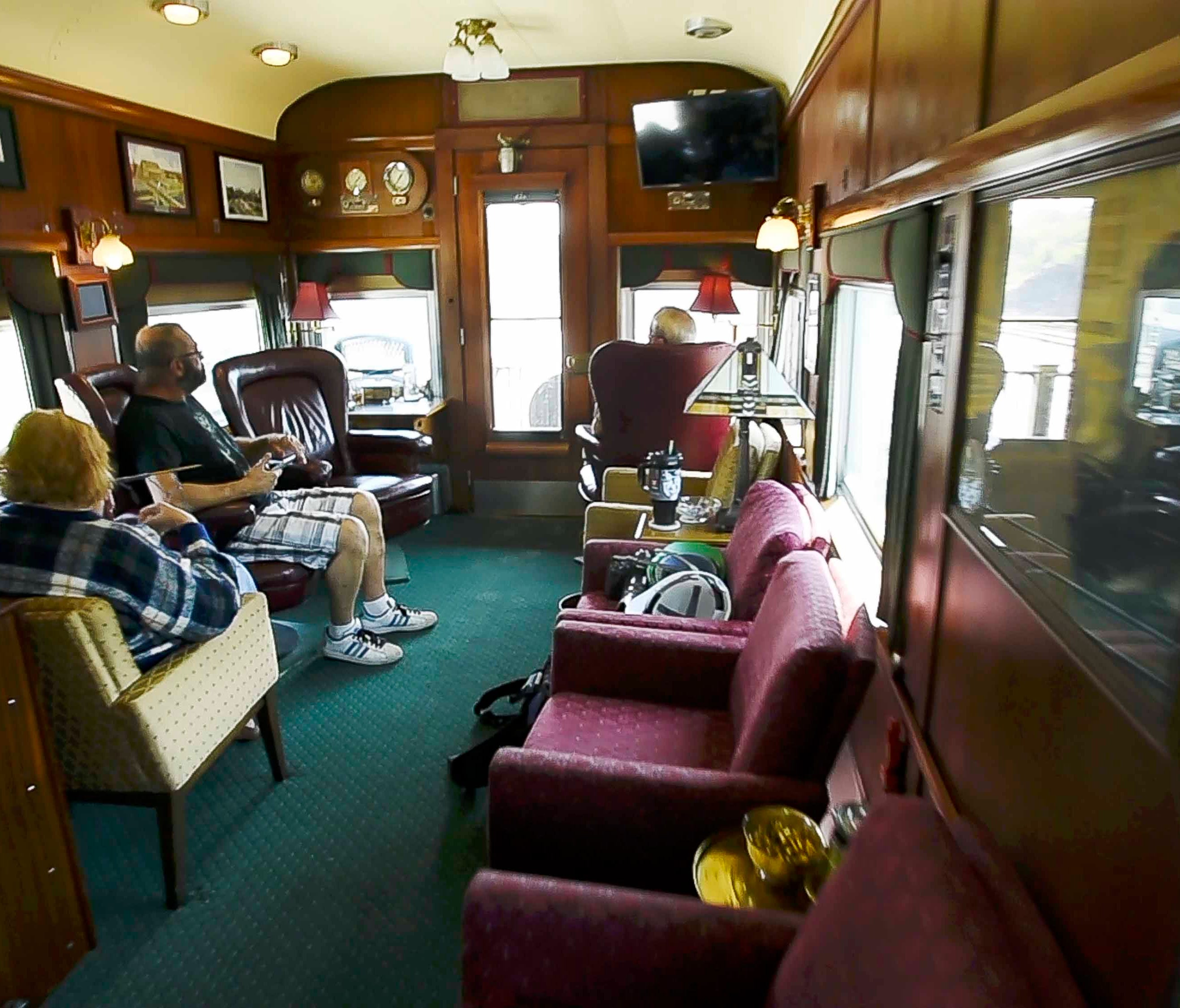 Passengers can relax in the cars' staterooms as they ride the rails.