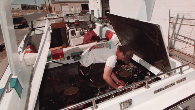 Tom Chandler works on a 39-foot Criss Craft Stinger 390.