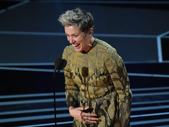 Frances McDormand accepts the Oscar.