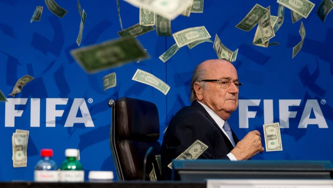 A comedian attacked FIFA President Joseph S. Blatter with money during a press conference at the Extraordinary FIFA Executive Committee Meeting at the FIFA headquarters on July 20, 2015 in Zurich, Switzerland.