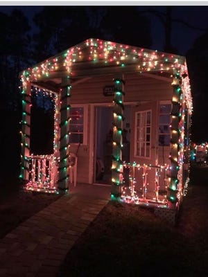 Twinkling lights adorn one of the cottages.