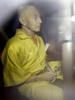 Robert Durst leaves federal court in an Orleans Parish Sheriff's vehicle after his arraignment Tuesday, April 14, 2015, in New Orleans. Durst pleaded not guilty Tuesday to a federal charge of possessing a gun after a felony conviction.