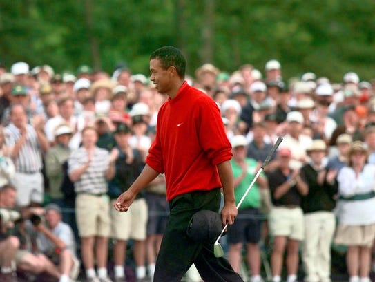 At the 18th hole, Tiger Woods acknowledges the gallery