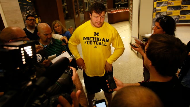 Michigan offensive lineman Graham Glasgow listens to a question from the media after practice Tuesday, Oct. 20, 2015, in Ann Arbor.