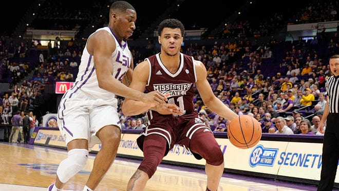 Mississippi State Bulldogs guard Quinndary Weatherspoon (11) dribbles in the first half against LSU Tigers guard Randy Onwuasor (14) at Pete Maravich Assembly Center. Mandatory Credit: Stephen Lew-USA TODAY Sports