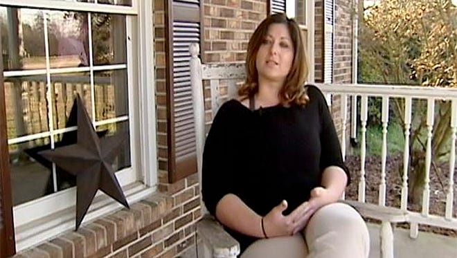 In this undated image made from video and provided by WYFF News-4, Teacher Leigh Anne Arthur speaks to a reporter in Union County, S.C. Some South Carolina high school students are calling for the return of Arthur who resigned after a student spread a nude picture of her through text messages and social media. Arthur, 33, told news outlets she left her cellphone on her desk Monday as she monitored a hallway during a class change. A 16-year-old boy took her phone, and with his own phone took pictures of nude images of Arthur on her phone, she said. (WYFF News-4 via AP)