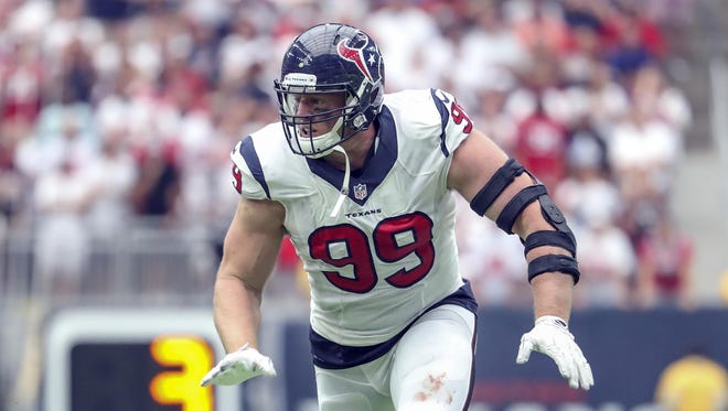 Houston defensive end J.J. Watt (99) continues to work his way back into form after missing the preseason.