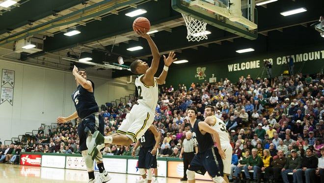 Catamounts guard Trae Bell-Haynes (2) leaps for a layup during the men's basketball game between the New Hampshire Wildcats and the Vermont Catamounts at Patrick Gym late last month.