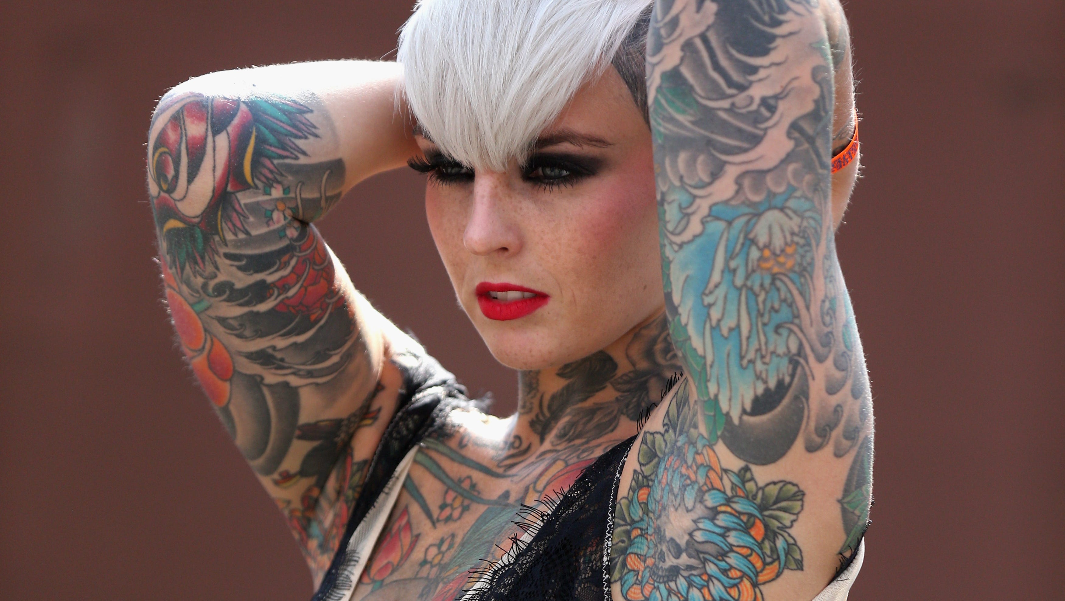 Tattoos have gone mainstream, but they still carry risks