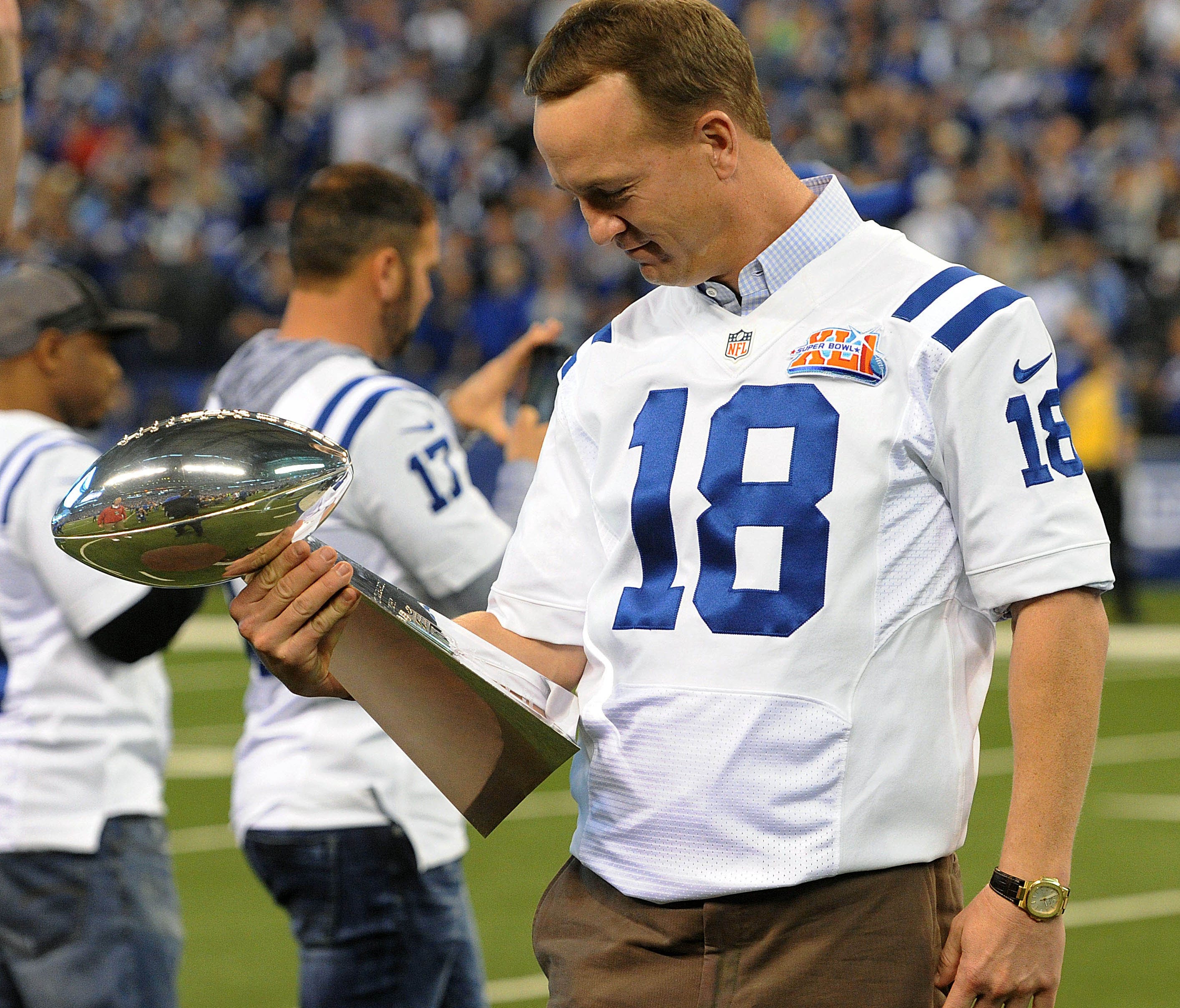 Indianapolis Colts former quarterback Peyton Manning holds the Lombardi Trophy at halftime of a game against the Tennessee Titans to honor the 10th anniversary of the 2006 Super Bowl championship team at Lucas Oil Stadium.