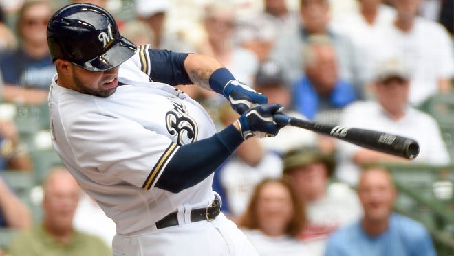Brewers' Manny Pina drives in three runs with a double in the sixth inning during the game against the Atlanta Braves at Miller Park.