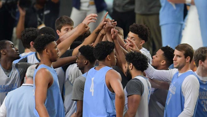 North Carolina players huddle during a practice session Friday. The Tar Heels are back in the Final Four, hoping to redeem themselves after losing to Villanova in the title game last year.