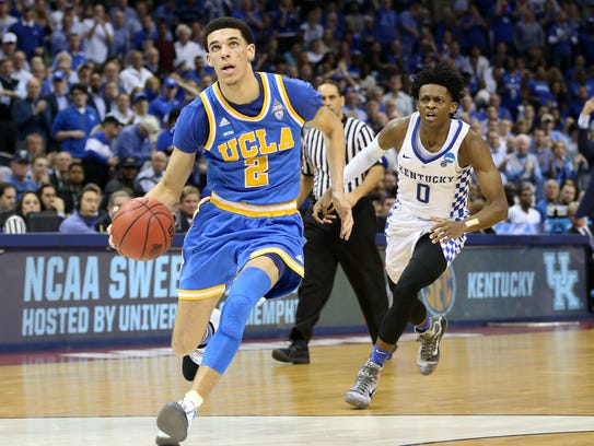 UCLA guard Lonzo Ball drives to the basket past Kentucky