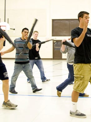The West High School Junior Navy ROTC drill team practice their drills on Wednesday, October 12, 2011. The program is ending after being placed on probation last year for having fewer than the required 100 cadets. The cadet numbers have since reached their quota, but the Navy decided to still ending the program. 