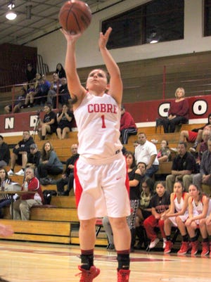Amari Jacquez pulls up and shoots during action against Socorro. She tallied eight points in the loss.