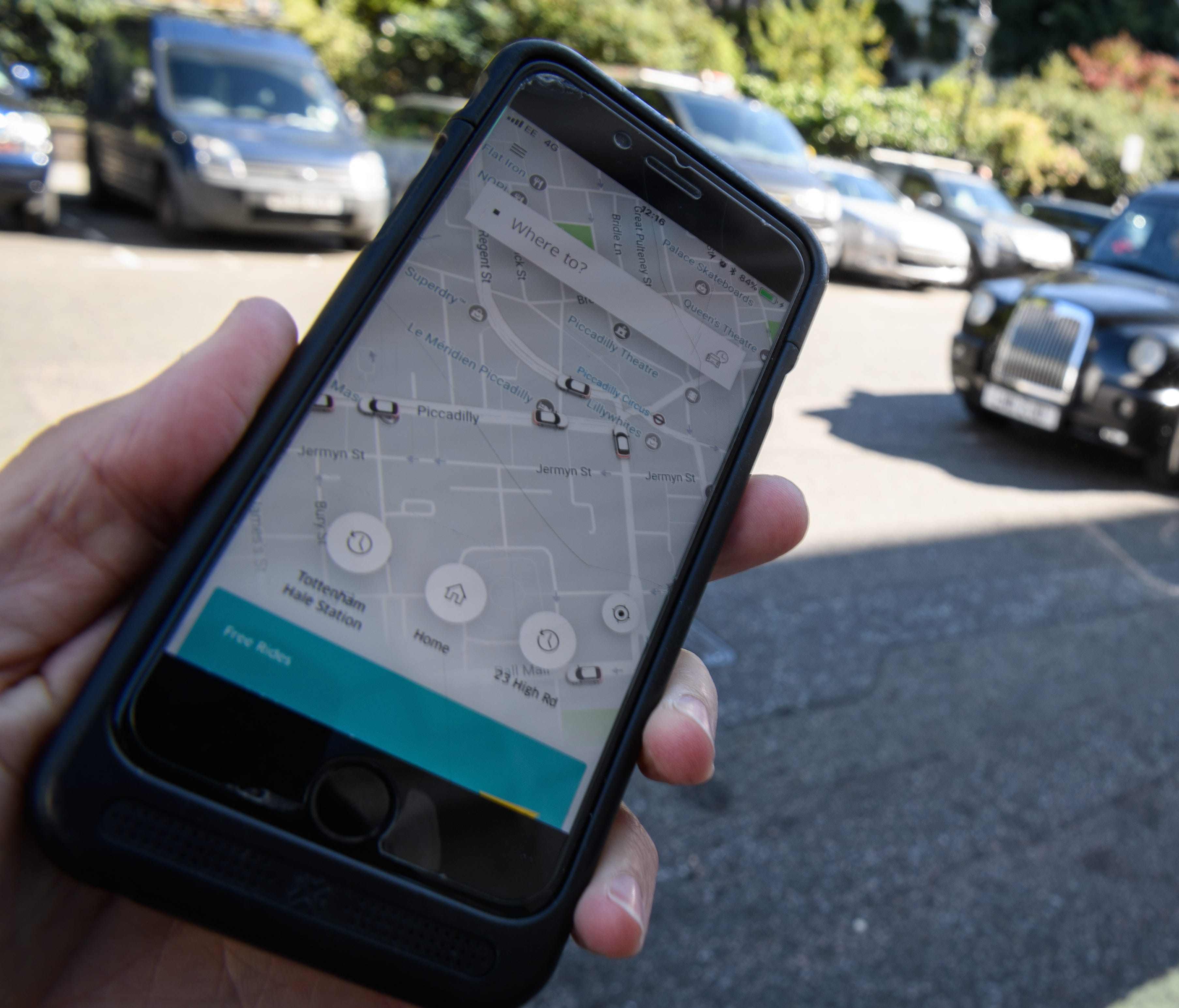In this photo Illustration, a phone displays the Uber ride-hailing app on Sept. 22, 2017 in London, England.
