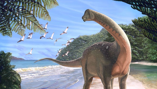 An artist's conception of a newly discovered species of dinosaur --
Mansourasaurus shahinae -- on a coastline in what is now the western Desert of Egypt approximately 80 million years ago.