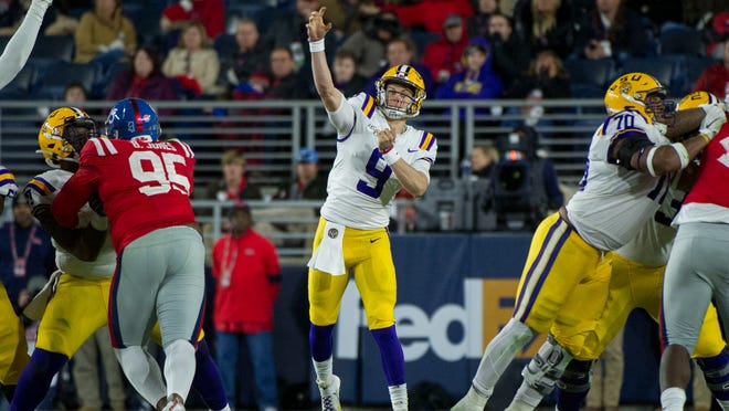 Nov 16, 2019; Oxford, MS, USA; LSU Tigers quarterback Joe Burrow (9) passes against the Mississippi Rebels during the first half at Vaught-Hemingway Stadium. Mandatory Credit: Justin Ford-USA TODAY Sports