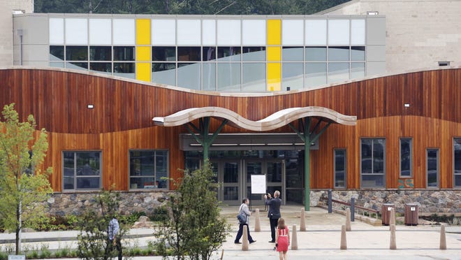 People attend an open house in July at the new Sandy Hook Elementary School, built to replace the shooting site.