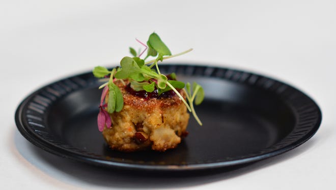 A Toasted Pecan & Blue Cheese Crab Cake with Blackberry Sauce by Tiger Point Golf Club at the Arc Gateway Crab Cake Cook-Off held at Seville Quarter on July 9th.
