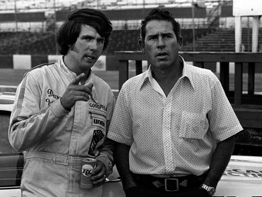 Franklin's Darrell Waltrip, left, takes time out from