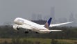 A United Boeing 787 Dreamliner takes off  within view
