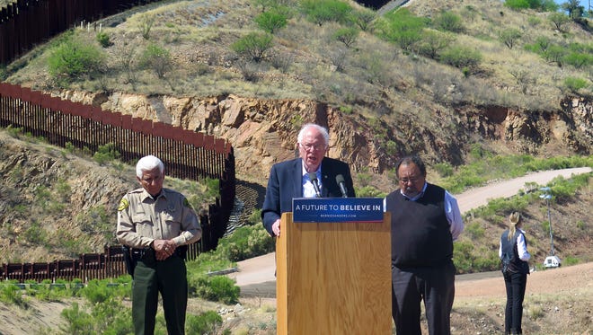 Democratic presidential candidate Bernie Sanders speaks near the U.S.-Mexico international border in Nogales, Ariz., Saturday, March 19, 2016. Sanders said he will fight for immigration reform as he stood near the border fence that divides Arizona and Mexico.