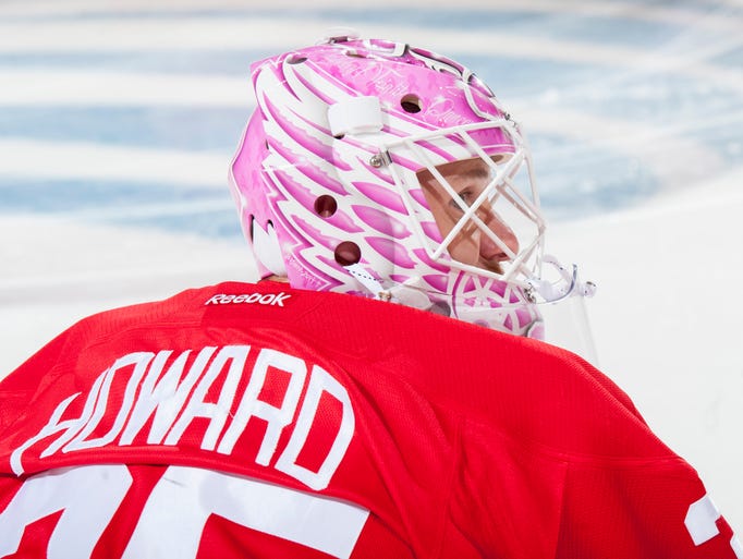 Red Wings goalie Jimmy Howard wears a pink helmet during
