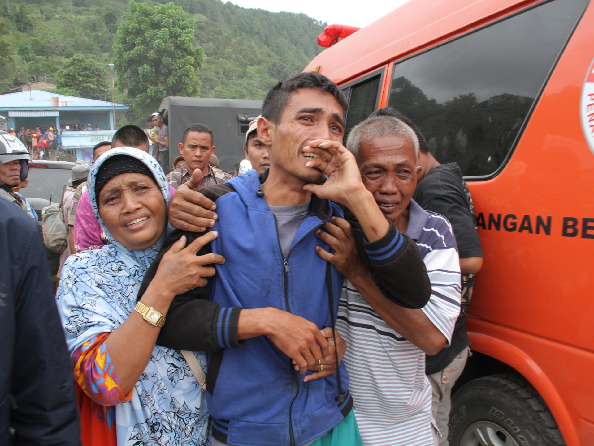 Survivors and family members react as they meet each