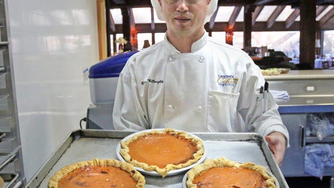 Brian Willoughby of Oostburg holds a tray of pumpkin pies, ready to serve to children from the Boys and Girls Club Thursday at the Lakeshore Culinary Institute in Sheboygan.