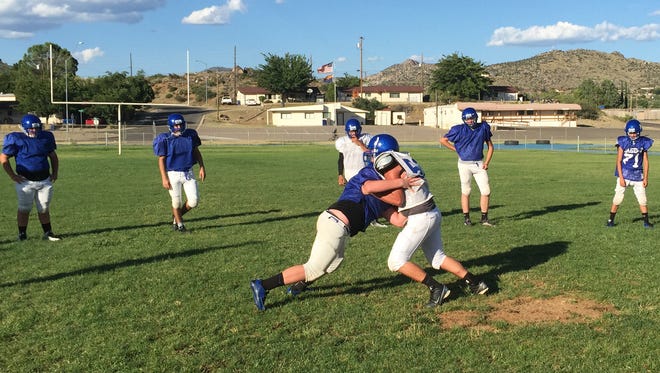 Bagdad goes one-on-one in tackling drills.