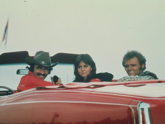 Burt Reynolds, Sally Field and Jerry Reed hit the road in "Smokey and the Bandit."