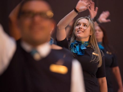 Alaska Airlines employees use a dance before the