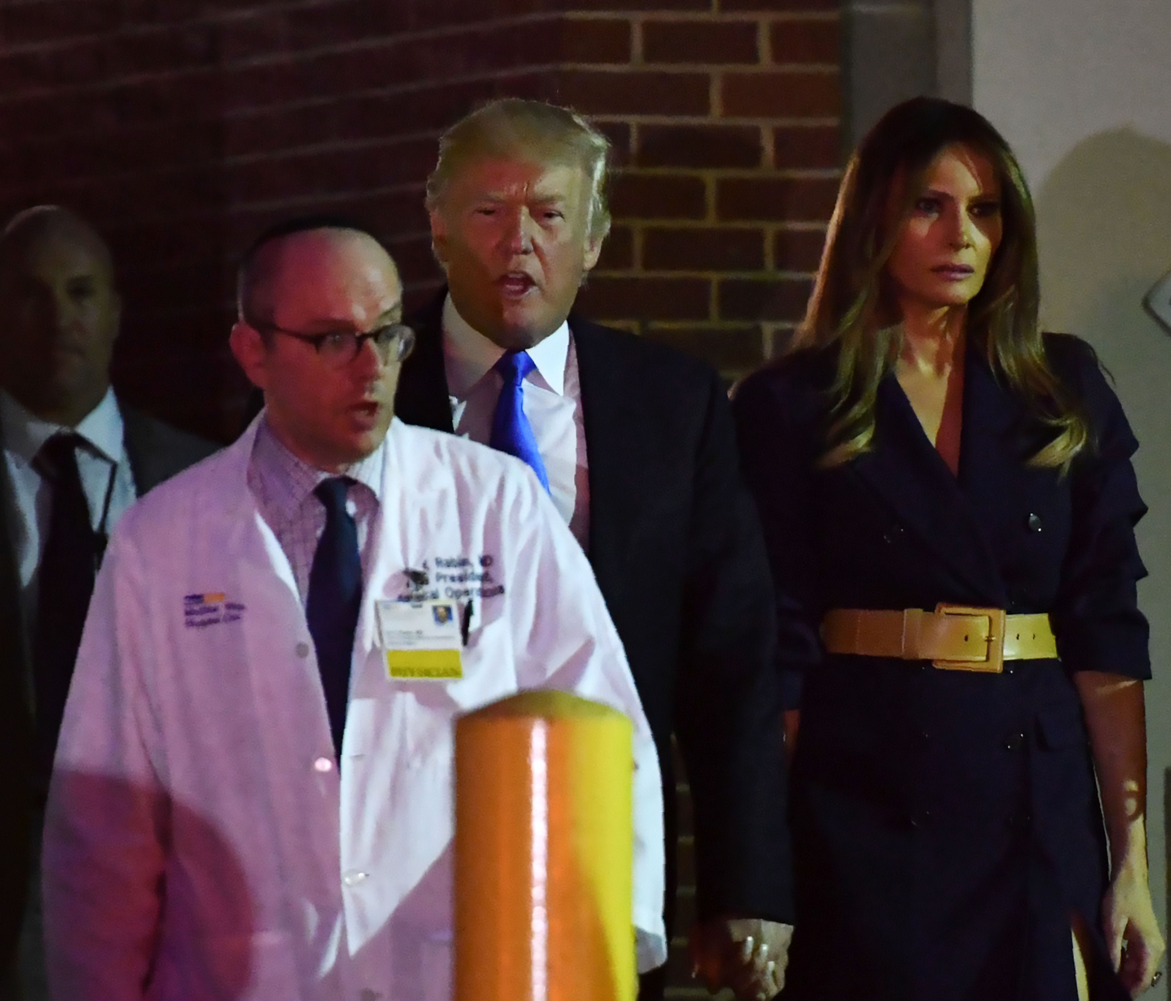 Dr. Ira Rabin escorts President Trump and first lady Melania Trump from MedStar Washington Hospital Center Wednesday.