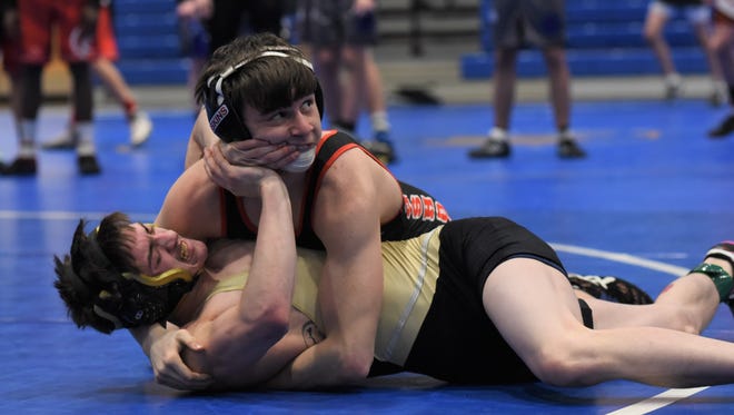 River View's Rann Zimmer wrestles Coshocton's Lucian Brink at 106 pounds in the East Central Ohio League tournament. Brink was named the Tribune's wrestler of the year.