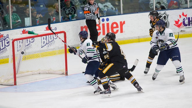 Plymouth’s Will Bitten (No. 41) fires the puck into the Sarnia goal during the second period. At right for the Whalers is linemate Matt Mistele (No. 22).