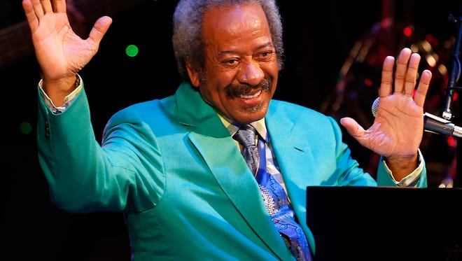 In this Tuesday April 30, 2013, photo, Allen Toussaint thanks the audience after a benefit concert/tribute in his honor at Harrah's New Orleans Theatre, in New Orleans. Legendary New Orleans musician and composer Toussaint died Monday, Nov. 9, 2015, after suffering a heart attack following a concert he performed in Madrid. He was 77. (David Grunfeld/NOLA.com The Times-Picayune via AP)