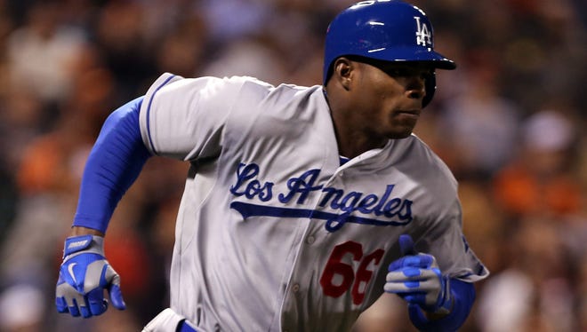 Yasiel Puig, who signed a seven-year, $42 million contract with the Dodgers, had a sensational rookie season, helping Los Angeles win the National League West.